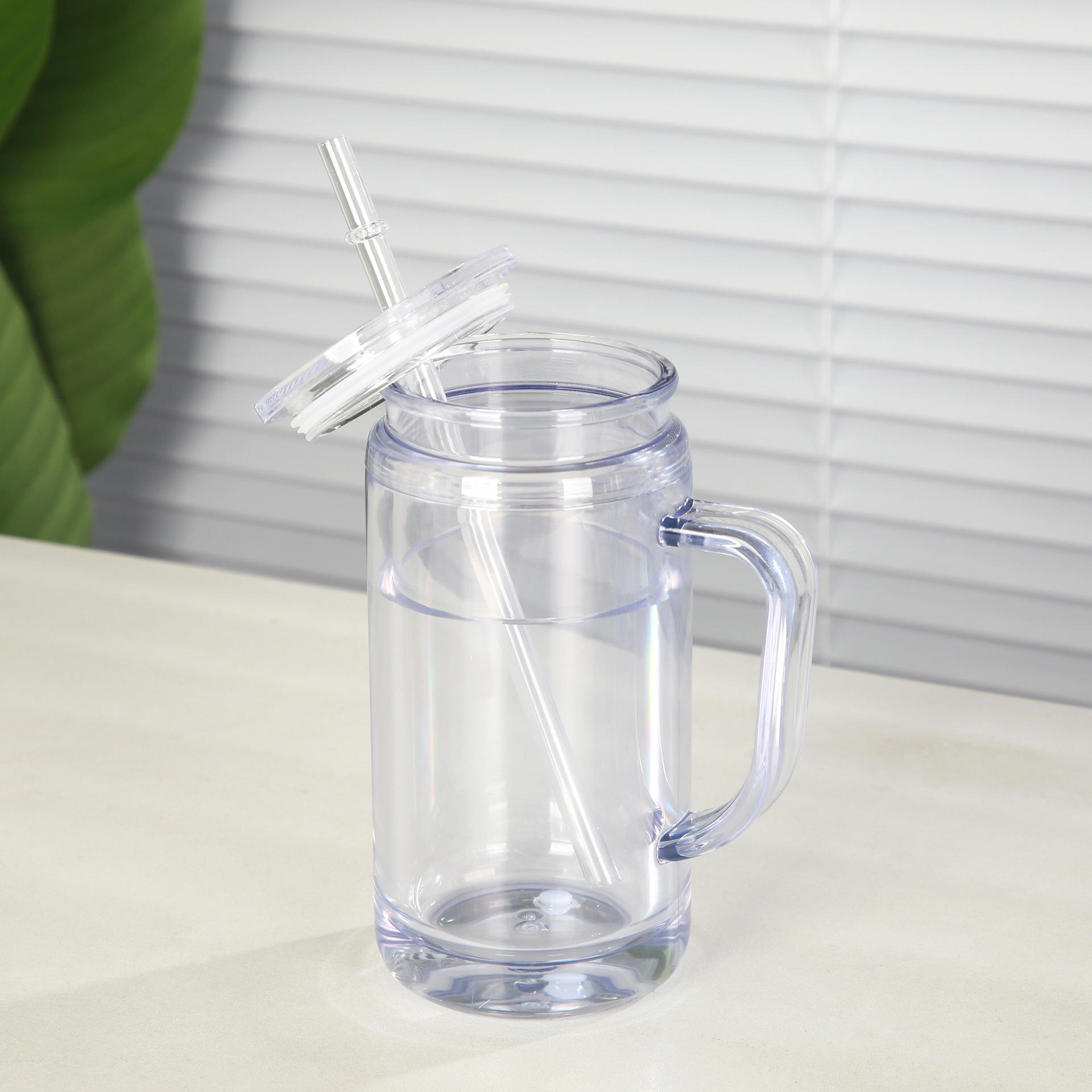 display-of-glow-in-the-dark-16oz-snow-globe-plastic-cups-with-handle